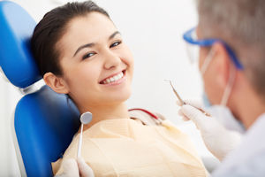 Smiling Dental Patient In Chair