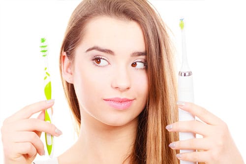 woman choosing a toothbrush