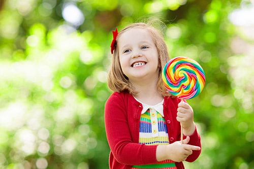 smiling child with candy